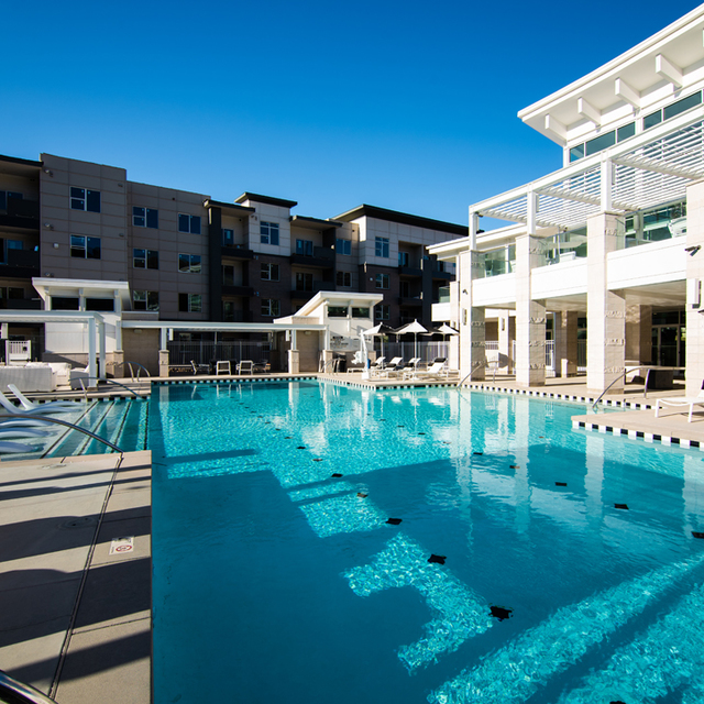 Rockpoint Apartments - Clubhouse Facade with Resort-Style Lap Pool  Rockpoint Apartments - Clubhouse Facade with Resort-Style Lap Pool